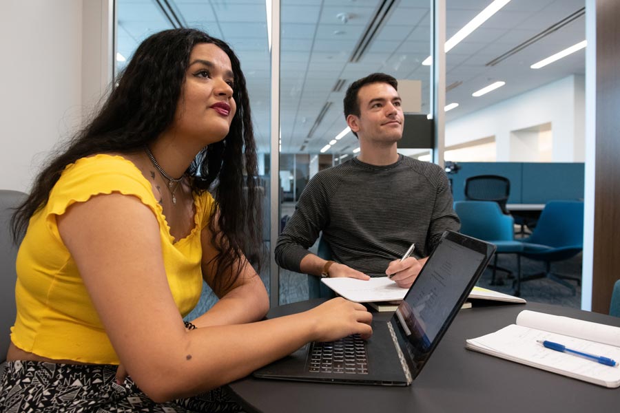 Graduate students study on campus.