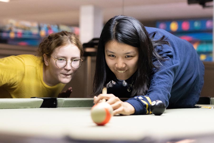 Students playing pool.